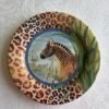 Gien Savane gebaksbordjes met het zebra-decor en panterprint rand ontworpen door Dominique Lalande